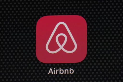 The Airbnb app icon is displayed on an iPad screen in Washington, D.C., on May 8, 2021. Airbnb says it’s banning the use of indoor security cameras in listings around the world by the end of next month. The San Francisco-based online rental platform said it making the change to simplify its security camera policy and continue efforts to prioritize privacy. (AP Photo/Patrick Semansky, File)