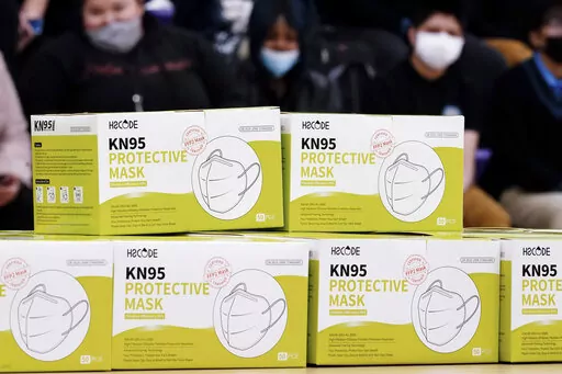 Shown are KN95 protective masks before being distributed to students at Camden High School in Camden, N.J., Wednesday, Feb. 9, 2022. As the omicron wave of the coronavirus subsides, several U.S. states including New York and Illinois ended mask mandates this week for indoor settings, while others lifted requirements at schools.  (AP Photo/Matt Rourke)
