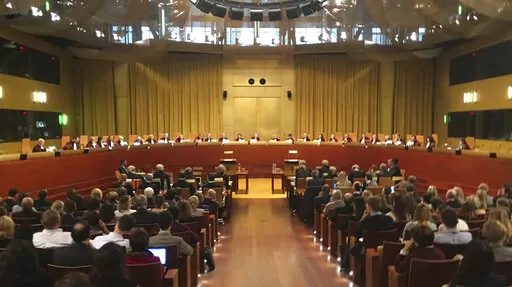 Judges preside over a hearing at the European Court of Justice in Luxembourg on Nov. 27, 2018. The European Union's highest court ruled on Wednesday, Feb. 16, 2022 that the 27-nation bloc can link financial backing for member states to respect for rule of law and that a challenge by Hungary and Poland should be dismissed. (AP Photo/Sylvain Plazy, File)