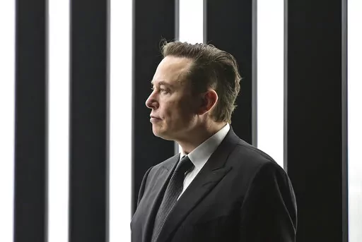 Elon Musk, Tesla CEO, attends the opening of the Tesla factory Berlin Brandenburg in Gruenheide, Germany, March 22, 2022. Elon Musk will be able to include new evidence from a Twitter whistleblower as he fights to get out of his $44 billion deal to buy the social media company, but Musk won’t be able to delay a high-stakes October trial over the dispute, a judge ruled Wednesday, Sept. 7, 2022. (Patrick Pleul/Pool via AP)