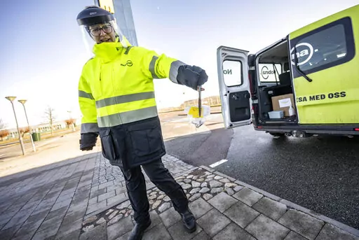 A member of staff collects the last COVID-19 PCR tests, at the Covid testing site of Svagertorp, Malmoe, Sweden, Tuesday, Feb. 8, 2022. Starting Wednesday, Sweden ends the wide-scale testing for COVID-19 even among people showing symptoms of coronavirus infection, a move that puts the Scandinavian nation at odds with most of Europe but could become the norm as the costs of testing yields fewer benefits as the omicron variant proves milder and governments begin to consider treating covid-19 as ot