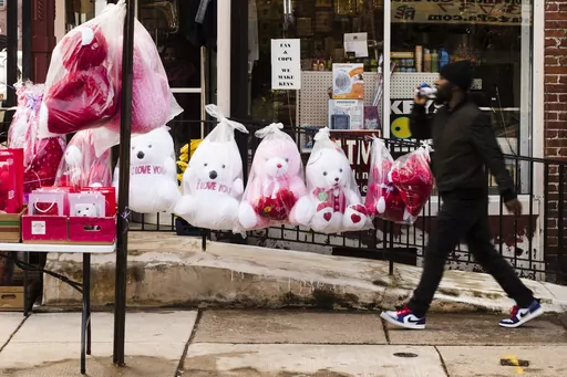 A pedestrian passes Valentine's day stuffed animals for sale ahead of the holiday in Philadelphia, Feb. 13, 2019. Romance scams are increasingly common, with consumers losing $1.3 billion to them in 2022, according to Federal Trade Commission reports. While anyone can fall victim to a romance scam, there are strategies you can use to reduce your risk. First, be wary of online relationships that move quickly. Common red flags include someone avoiding video calls or in-person meetings. (AP Photo/M