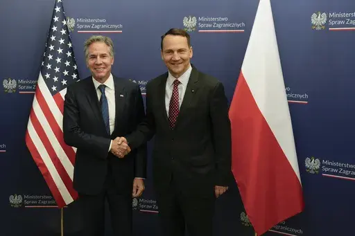 U.S. Secretary of State Antony Blinken, left, welcomes by Polish Foreign Minister Radosław Sikorski, right, for talks in Warsaw, Poland, Thursday, Sept. 12, 2024. (AP Photo/Czarek Sokolowski)