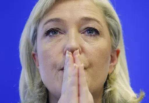 French far right presidential candidate Marine Le Pen attends a party meeting in Nanterre, France, Thursday, Jan. 12, 2012. (AP Photo/Jacques Brinon. File)