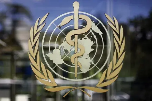 The logo of the World Health Organization is seen at the WHO headquarters in Geneva, Switzerland, June 11, 2019. A death in Mexico was caused by a strain of bird flu that has never before been found in a human, the World Health Organization said Wednesday. (AP Photo/Anja Niedringhaus, File)