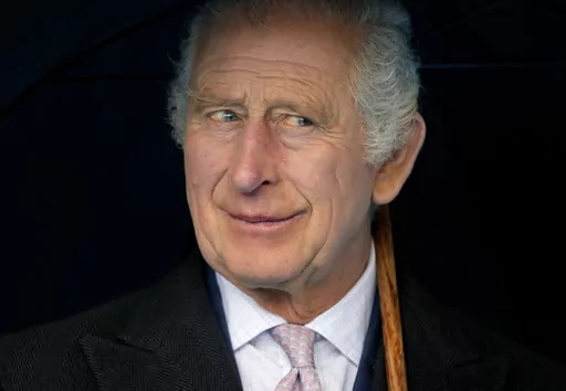 Britain's King Charles III smiles during a boat trip, in Hamburg, Germany, Friday, March 31, 2023. King Charles III arrived Wednesday for a three-day official visit to Germany. Britain’s royal family turns the page on a new chapter with the coronation of King Charles III. Charles ascended the throne when his mother, Queen Elizabeth II, died last year. But the coronation Saturday is a religious ceremony that provides a more formal confirmation of his role as head of state and titular head of th