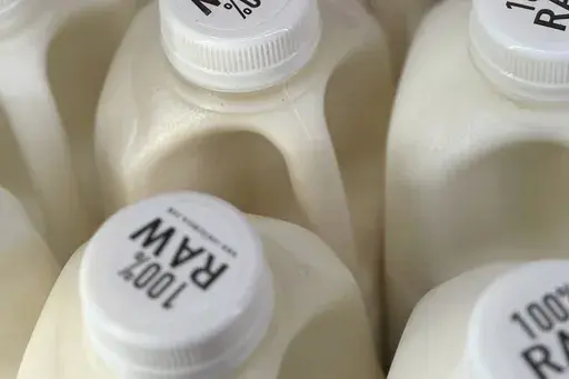 Bottles of raw milk are displayed for sale at a store in Temecula, Calif., on Wednesday, May 8, 2024. (AP Photo/JoNel Aleccia, file)