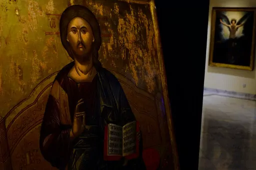 A looted 500 year-old Orthodox icon of the Enthroned Christ is seen at the Byzantine Museum after being returned, in capital Nicosia, Cyprus, on Tuesday, July 12, 2022. A 500 year-old Orthodox icon of the Enthroned Christ that was looted from a 12th century church in the breakaway north of ethnically divided Cyprus was repatriated after the end of a years-long legal journey from Zurich, Switzerland. (AP Photo/Petros Karadjias)