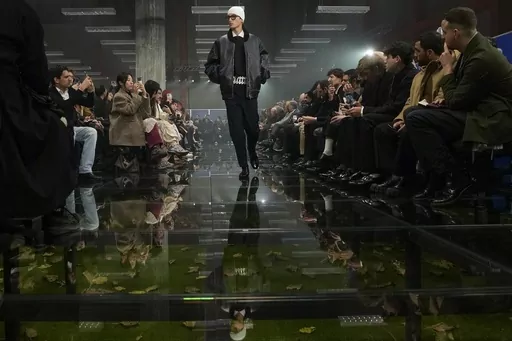 A model wears a creation part of the men's Prada Fall-Winter 2024-2025 collection, that was presented in Milan, Italy, Sunday, Jan. 14, 2024. (AP Photo/Luca Bruno).