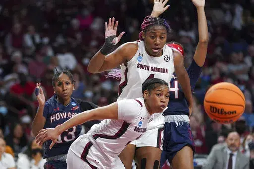 South Carolina forward Aliyah Boston, top, and guard Zia Cooke, bottom, look at a loose ball during the first half of a first round game against Howard in the NCAA women's college basketball tournament Friday, March 18, 2022 in Columbia, S.C. (AP Photo/Sean Rayford)