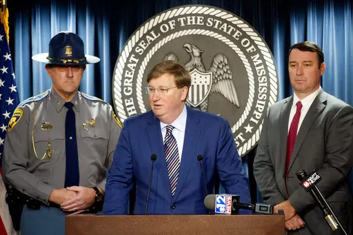 Mississippi Gov. Tate Reeves, center, expresses his gratitude for law enforcement during COVID-19, at a news conference at the Walter Sillers Building in Jackson, Miss., on Monday, Dec. 20, 2021. (Eric Shelton/The Clarion-Ledger via AP)