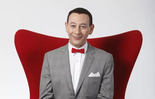 Actor Paul Reubens portraying Pee-wee Herman poses for a portrait while promoting "The Pee-wee Herman Show" live stage play, Monday, Dec. 7, 2009, in Los Angeles. Reubens died Sunday night after a six-year struggle with cancer that he did not make public, his publicist said in a statement. (AP Photo/Danny Moloshok, File)