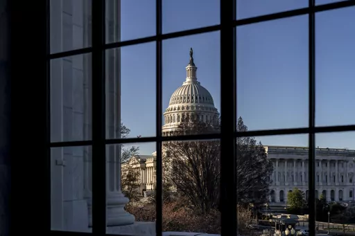 The Capitol is seen through a window in the Russell Senate Office Building as policymakers wrestle with fallout from the failure of Silicon Valley Bank, in Washington, March 15, 2023. While President Joe Biden called Monday on Congress to strengthen the rules for banks to prevent future failures, lawmakers are divided on whether any legislation is needed. (AP Photo/J. Scott Applewhite, File)