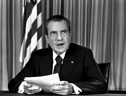 President Richard Nixon sits in his White House office, Aug. 16, 1973, as he poses for pictures after delivering a nationwide television address dealing with Watergate. In 1974, Richard Nixon faced possible charges for a wide range of alleged wrongdoing, from bribery to obstruction of justice, when Gerald Ford pardoned him just weeks after he resigned. (AP Photo, File)