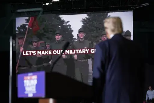 Republican presidential nominee former President Donald Trump watches as a video plays during a campaign rally at Greensboro Coliseum, Tuesday, Oct. 22, 2024, in Greensboro, N.C. (AP Photo/Alex Brandon)