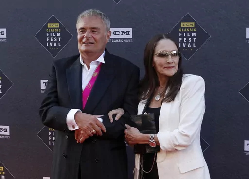 Leonard Whiting, left, and Olivia Hussey arrive at the screening of "The Producers" at the 2018 TCM Classic Film Festival Opening Night at the TCL Chinese Theatre on April 26, 2018, in Los Angeles. A Los Angeles County judge on Thursday, May 25, 2023, said she will dismiss a lawsuit that the stars, Whiting and Hussey, of 1968's “Romeo and Juliet" filed over the film's nude scene, which they said involved them being subjected to fraud, and sexual abuse and harassment when they were in their tee