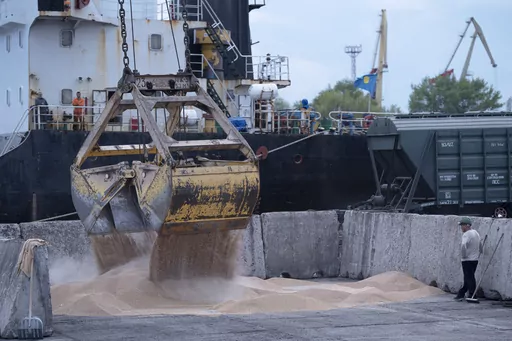 Workers load grain at a grain port in Izmail, Ukraine, on April 26, 2023. The United Nations is racing to extend a deal that has allowed for shipments of Ukrainian grain through the Black Sea to parts of the world struggling with hunger, helping ease a global food crisis exacerbated by the war that Russia launched more than a year ago. (AP Photo/Andrew Kravchenko, File)