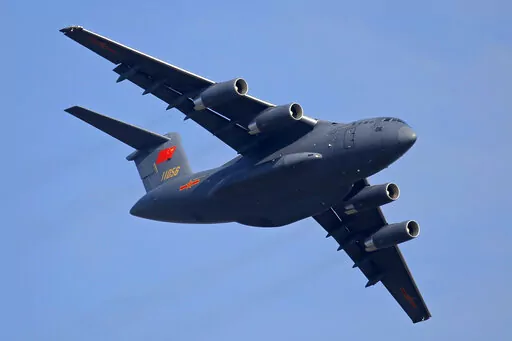 A Y-20 transport aircraft of the Chinese People's Liberation Army (PLA) Air Force performs during the 12th China International Aviation and Aerospace Exhibition, also known as Airshow China 2018, in Zhuhai city, southern China on Nov. 7, 2018. Media and military experts said Sunday, April 10, 2022, that six Chinese Air Force Y-20 transport planes landed at Belgrade's commercial airport early Saturday, reportedly carrying HQ-22 surface-to-air missile systems for the Serbian military.(AP Photo/Kin