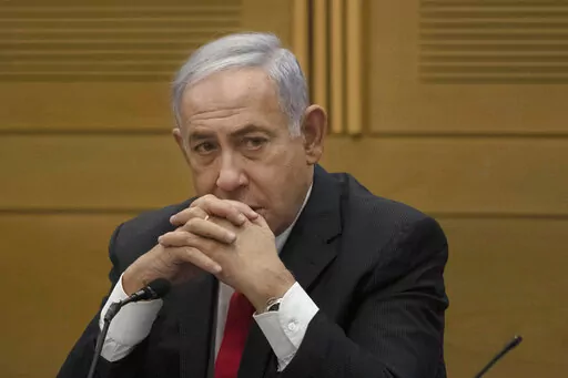 Former Israeli Prime Minister Benjamin Netanyahu speaks to right-wing opposition party members, at the Knesset, Israel's parliament, in Jerusalem on June 14, 2021. Former Israeli Prime Minister Benjamin Netanyahu is negotiating a plea deal in his corruption case. A person involved in the negotiations said Sunday, Jan. 16, 2021, that the agreement is likely to be announced in the coming days and could usher Netanyahu off the Israeli political stage for years. (AP Photo/Maya Alleruzzo, File)