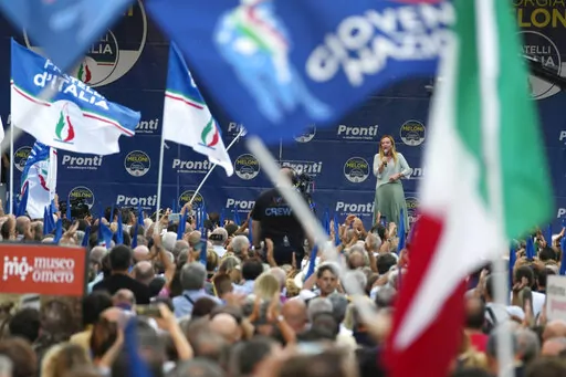 Right-wing party Brothers of Italy's leader Giorgia Meloni, center-right on stage, addresses a rally as she starts her political campaign ahead of Sept. 25 general elections, in Ancona, Italy, Tuesday, Aug. 23, 2022. The Brothers of Italy party has won the most votes in Italy’s national election. The party has its roots in the post-World War II neo-fascist Italian Social Movement. Giorgia Meloni has taken Brothers of Italy from a fringe far-right group to Italy’s biggest party. (AP Photo/Dom