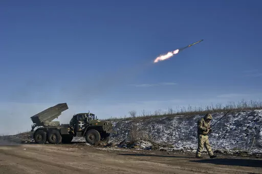Ukrainian army Grad multiple rocket launcher fires rockets at Russian positions in the frontline near Soledar, Donetsk region, Ukraine, Wednesday, Jan. 11, 2023. Russia's Defense Ministry said Friday Jan. 13, 2023 that its forces have captured the salt-mining town of Soledar, the focus of a bloody battle between Russian and Ukrainian forces for months. (AP Photo/Libkos, File)