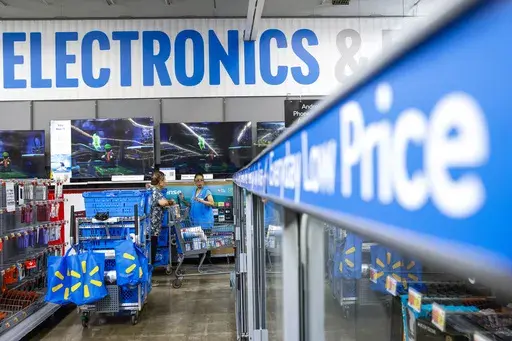 People walk around a Walmart Superstore in Secaucus, New Jersey, on July 11, 2024. (AP Photo/Eduardo Munoz Alvarez, File)