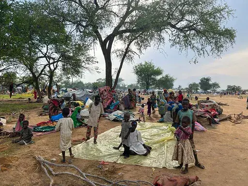 Sudanese refugees who fled the conflict in Sudan gather Monday, July 10, 2023, at the Zabout refugee Camp in Goz Beida, Chad. Some 260,000 people have fled Darfur into neighboring Chad after RSF fighters and allied Arab militias stormed a number of cities and towns, burning houses and driving out residents. (Pierre Honnorat/WFP via AP, File)