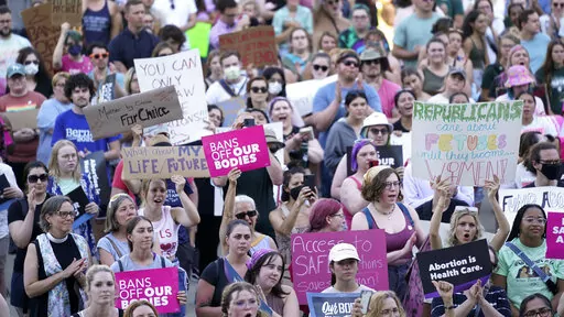 Abortion rights protesters attend a rally outside the state Capitol in Lansing, Mich., on June 24, 2022, following the United States Supreme Court's decision to overturn Roe v. Wade. Judge Elizabeth Gleicher, of the Court of Claims, on Wednesday, Sept. 7, 2022, struck down Michigan's 1931 anti-abortion law, months after suspending it. Judge Gleicher said the law, long dormant before U.S. Supreme Court overturned Roe v. Wade in June, violates the Michigan Constitution. (AP Photo/Paul Sancya, File