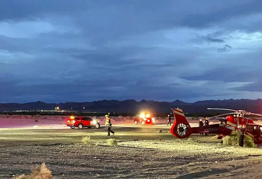 This image provided by Boulder City communications manager Lisa LaPlante shows a Grand Canyon tour helicopter after a Tuesday, Dec. 27, 2022, crash described as a "hard landing" at Boulder City, Nev., Municipal Airport. Officials say the pilot and six passengers were taken to Las Vegas-area hospitals with injuries that were not life-threatening. (Lisa LaPlante/Boulder City via AP)