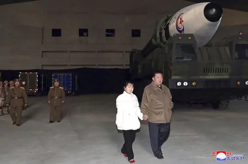This photo provided on Nov. 19, 2022, by the North Korean government shows North Korean leader Kim Jong Un, right, and his daughter inspecting a missile at Pyongyang International Airport in Pyongyang, North Korea, Friday, Nov. 18, 2022. Independent journalists were not given access to cover the event depicted in this image distributed by the North Korean government. The content of this image is as provided and cannot be independently verified. Korean language watermark on image as provided by s