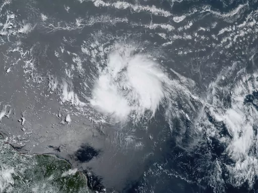 This GeoColor satellite image taken Tuesday, June 20, 2023 and provided by NOAA, shows Tropical Storm Bret as it chugged toward the eastern Caribbean. (NOAA via AP)