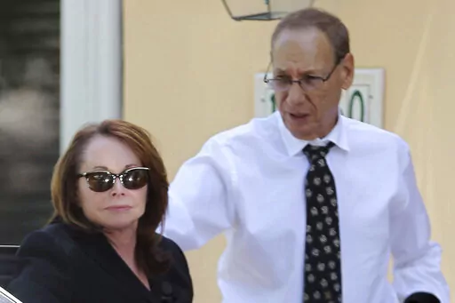 Shirley Sotloff and her husband, Arthur B. Sotloff, exit a car as they return home after a memorial service for their son, slain journalist Steven Sotloff, at Temple Beth Am, Friday, Sept. 5, 2014, in Pinecrest, Fla. The family of slain American journalist Steven Sotloff filed a federal lawsuit Friday, May 13, 2022, accusing prominent Qatari institutions of wiring $800,000 to an Islamic State “judge” who ordered the murder of Sotloff and another American journalist, James Foley. (Carl Juste/