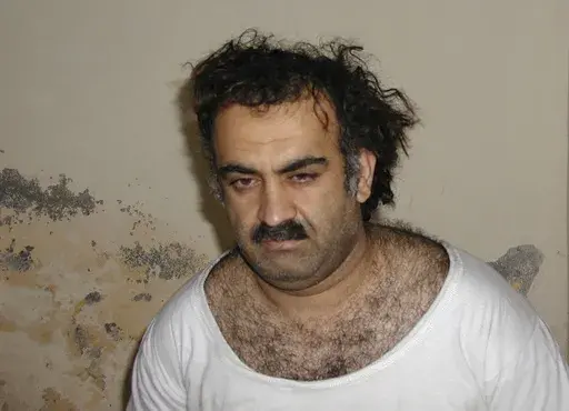 This Saturday March 1, 2003, photo obtained by The Associated Press shows Khalid Shaikh Mohammad, the alleged Sept. 11 mastermind, shortly after his capture during a raid in Pakistan. The suspected architect of the Sept. 11, 2001, attacks and his fellow defendants may never face the death penalty under plea agreements now under consideration to bring an end to their more than decadelong prosecution, the Pentagon and FBI have advised families of some of the thousands killed. (AP Photo)