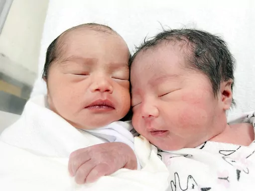 Newborn twins lie next to each other in a hospital in Tamuning, Guam on May 27, 2023. Many, including newborns, remain without electricity as Guam recovers from Typhoon Mawar (Thomas Shieh via AP)