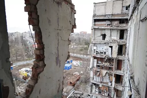 A view of an apartment building, damaged during a heavy fighting, in Mariupol, in Russian-controlled Donetsk region, eastern Ukraine, Thursday, Jan. 5, 2023. (AP Photo/Alexei Alexandrov)