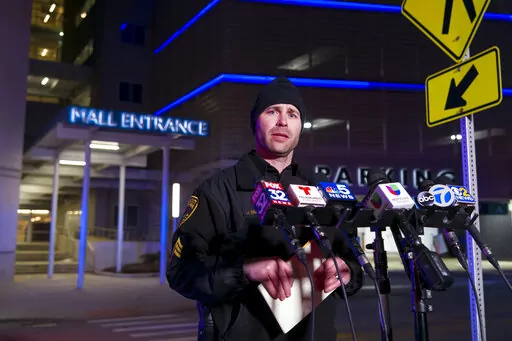 Rosemont Public Safety Department Sgt. Joe Balogh updates the media staged outside the Rosemont Outlet Mall where a fatal shooting occurred inside, Friday, March 25, 2022, in Rosemont, Ill. (Tyler Pasciak LaRiviere/Chicago Sun-Times via AP)