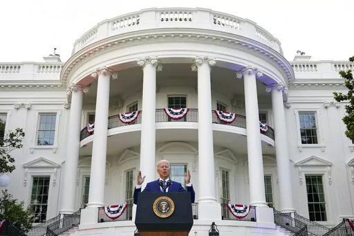 President Joe Biden speaks during an Independence Day celebration on the South Lawn of the White House, July 4, 2021, in Washington. Last Fourth of July, Biden gathered hundreds of people outside the White House for an event that would have been unthinkable for many Americans the previous year. With the coronavirus in retreat, they ate hamburgers and watched fireworks over the National Mall. (AP Photo/Patrick Semansky, File)