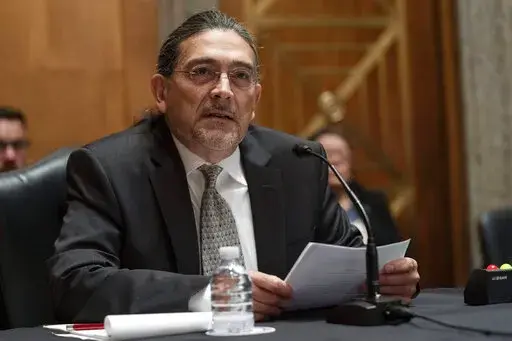Then-Census Bureau Director nominee Robert Santos, testifies before the Senate Homeland Security and Governmental Affairs committee, Thursday, July 15, 2021, on Capitol Hill in Washington. Santos, now the Census Bureau director, said Tuesday, Aug. 16, 2022, in an interview with The Associated Press that the statistical agency was starting its outreach efforts with hard-to-reach communities earlier, rather than just before the next count, which is in 2030. (AP Photo/Jacquelyn Martin, File)