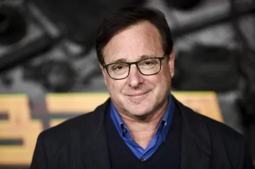 Bob Saget arrives at a screening of "MacGruber" on Dec. 8, 2021, in Los Angeles. Saget's family has released a statement on the cause of his death last month in Florida, citing authorities saying the actor-comedian died from an accidental blow to the head. (Photo by Richard Shotwell/Invision/AP, File)