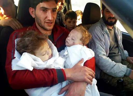 Abdel Hameed Alyousef, 29, holds his twin babies who were killed during a suspected chemical weapons attack, in Khan Sheikhoun in the northern province of Idlib, Syria, April 4, 2017. Legal and moral taboos were shattered with the use of chemical weapons during Syria's civil war. Hundreds were killed in poison gas attacks widely blamed on President Bashar Assad’s forces under the protection of his chief ally, Russian leader Vladimir Putin. Several years later, concerns are growing that such we