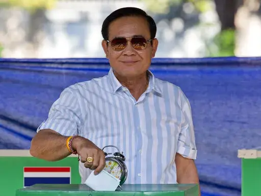 Thailand's Prime Minister Prayuth Chan-ocha casts his vote at a polling station in Bangkok, Thailand, Sunday, March 24, 2019, during the nation's first general election since the military seized power in a 2014 coup. Thailand's Constitutional Court suspended Prayuth from his duties on Wednesday, Aug. 25, 2022, while it decides whether he violated the country's term limits, potentially opening a new chapter of turmoil in the nation's troubled politics. (AP Photo/Gemunu Amarasinghe, File)