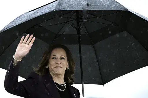Vice President Kamala Harris boards Air Force Two as she departs from Ellington Airport in Houston, Thursday, July 25, 2024. Harris is returning to Washington, after delivering remarks at a teachers' union event. (Brendan Smialowski/Pool via AP)