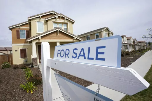 A for sale sign is posted in front of a home in Sacramento, Calif., Thursday, March 3, 2022. The Federal reserve is expected at its meeting this week to raise its key interest rate by a substantial three-quarters of a point for the third consecutive time. Another hike that large would lift its benchmark rate — which affects many consumer and business loans — to a range of 3% to 3.25%, the highest level in 14 years.(AP Photo/Rich Pedroncelli, File)