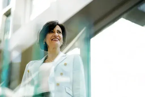 Dr. Rochelle Walensky, director of the U.S. Centers for Disease Control and Prevention, poses during an interview with The Associated Press on Wednesday, Dec. 8, 2021, in Atlanta. More than 40 cases of the omicron variant have been reported in the U.S. so far, with most of them people who were vaccinated and nearly all of them suffering only mild illness, Walensky said Wednesday. ​(AP Photo/Brynn Anderson)