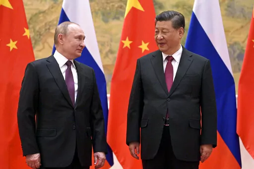 Chinese President Xi Jinping, right, and Russian President Vladimir Putin talk to each other during their meeting in Beijing on Feb. 4, 2022. Putin and Xi will meet next week at a summit in Uzbekistan, a Russian official said Wednesday, Sept. 7. (Alexei Druzhinin, Sputnik, Kremlin Pool Photo via AP, File)