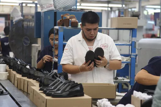 People work in a shoe maquiladora or factory in Leon, Mexico, Monday, Feb. 7, 2023. t has been nearly two years since the United States began pressing Mexico over labor rights violations, by using rapid dispute resolution methods (RRM) contained in the U.S.-Mexico Canada free trade agreement. (AP Photo/Mario Armas)