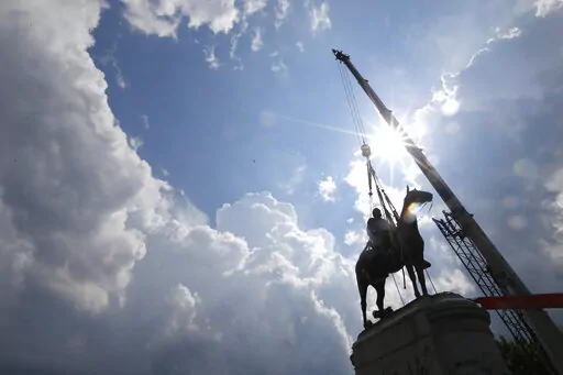 Work crews work to remove the statue of confederate general Stonewall Jackson, Wednesday, July 1, 2020, in Richmond, Va. Richmond, Virginia, has secured an $11 million philanthropic donation to build a new interpretive center city officials hope will someday be part of an ambitious, long-envisioned memorial campus honoring the memory of enslaved people. Richmond’s grant is among more than $16 million in total funding The Mellon Foundation is providing to recipients in the former Confederate ca