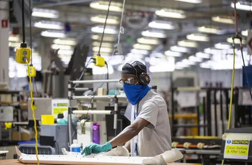 A worker prepares materials and construction parts at the Boeing Interiors Responsibility Center in North Charleston, S.C., on May 31, 2023. On Wednesday, the Commerce Department issues its second of three estimates of how the U.S. economy performed in the second quarter of 2023.(Gavin McIntyre/The Post And Courier via AP, Pool, File)