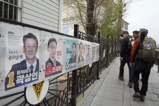 People pass by posters of candidates running for the upcoming parliamentary election in Seoul, South Korea, Wednesday, April 3, 2024. As South Koreans prepare to vote for a new 300-member parliament next week, many are choosing their livelihoods and other domestic topics as their most important election issues. This represents a stark contrast from past elections, which were overshadowed by security and foreign policy issues like North Korean nuclear threats and the U.S. security commitment.(AP 