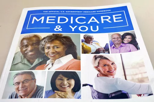 In this Nov. 8, 2018 file photo, the U.S. Medicare Handbook is photographed in Washington. Making more than the maximum income level for Medicaid isn’t necessarily a deal breaker. After a long pause during the COVID-19 public health emergency, states have resumed checking whether Medicaid beneficiaries’ income meets the eligibility requirements. (AP Photo/Pablo Martinez Monsivais)